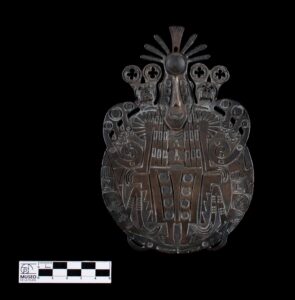 metal artifact with complex relief